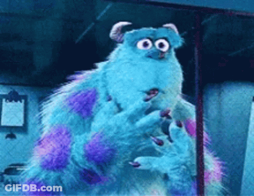 A Blue And Purple Monster From Monsters Inc Is Standing In A Room GIF