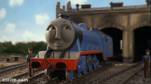 A Blue And Red Train With A Face That Says ' Thomas ' On It GIF