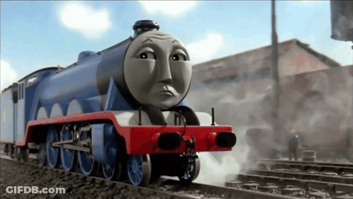 A Blue And Red Train With A Sad Face On It GIF