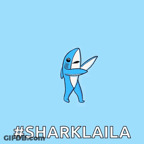 A Blue And White Cartoon Shark With The Words #Sharklaila Below It GIF