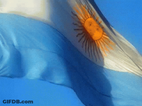 A Blue And White Flag With A Yellow Sun On It GIF