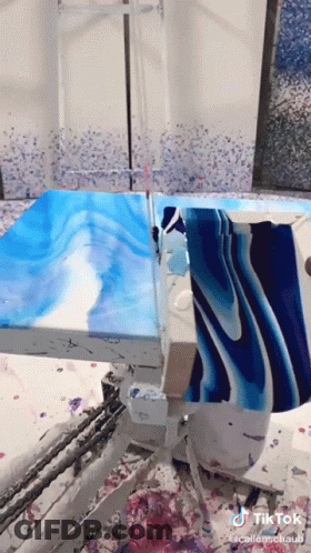 A Blue And White Painting Is Being Painted On A Table With A Tik Tok Watermark GIF