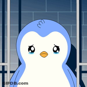 A Blue And White Penguin Is Behind Bars With A Sad Look On Its Face GIF