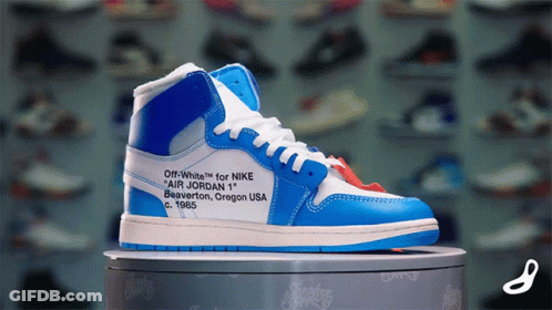 A Blue And White Shoe That Says Off White For Nike GIF