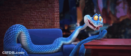 A Blue And White Snake Is Sitting On A Couch GIF