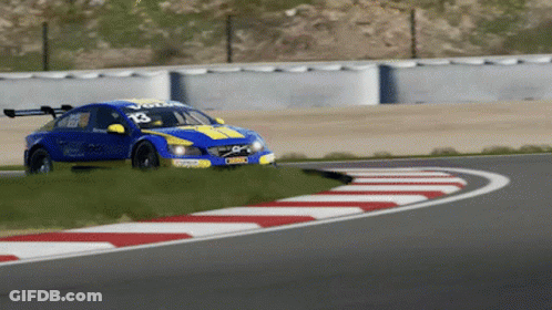 A Blue And Yellow Racing Car With The Number 13 On It GIF