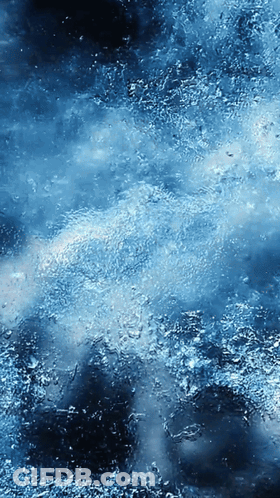 A Blue Background With A Lot Of Small Bubbles On It GIF