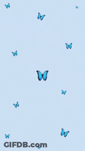 A Blue Background With Blue Butterflies Flying In The Air GIF