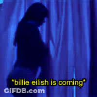 A Blue Background With The Words Billie Eilish Is Coming Written On It GIF