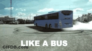 A Blue Bus Is Driving Down A Road With The Words `` Like A Bus '' Written On The Bottom . GIF