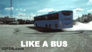 A Blue Bus Is Driving Down A Street With The Words Like A Bus Written Below It GIF