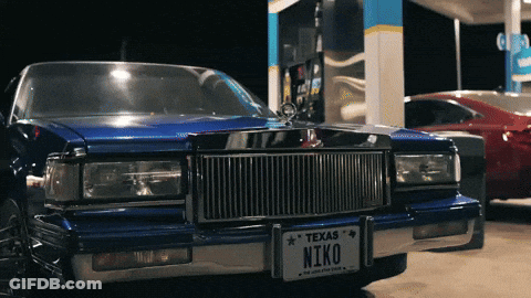 A Blue Car Has A Texas License Plate That Says Niko GIF