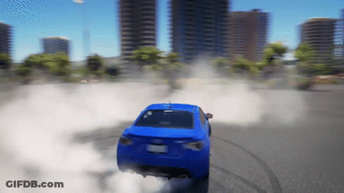 A Blue Car Is Drifting On A City Street With Smoke Coming Out Of The Exhaust Pipe GIF