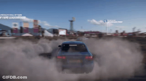 A Blue Car Is Driving Down A Dirt Road In Front Of A Sign That Says ' America 'S Wall Of Fame ' GIF