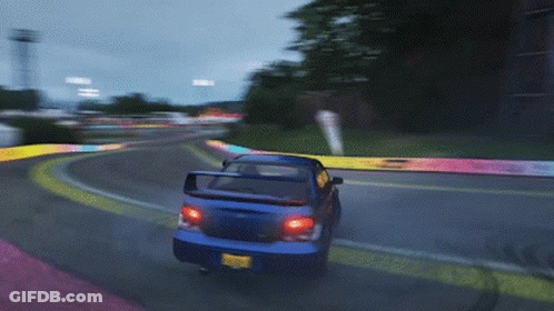 A Blue Car Is Driving Down A Road With A Yellow License Plate That Says ' Jc ' On It GIF