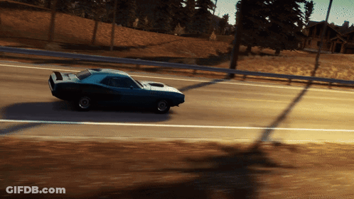 A Blue Car Is Driving Down A Road With Trees In The Background GIF