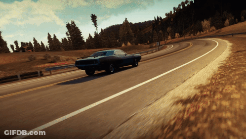 A Blue Car Is Driving Down A Road With Trees In The Background GIF