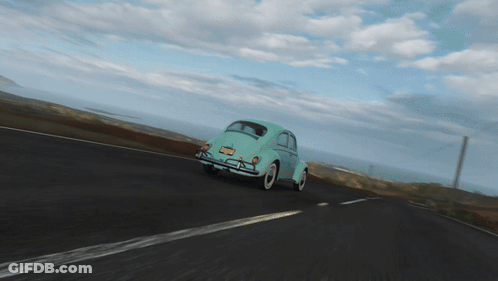 A Blue Car Is Driving Down The Road With A Windmill In The Background GIF