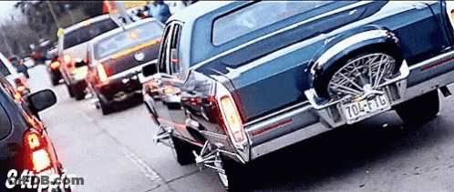 A Blue Car With A License Plate That Says 704 Ft Lb GIF