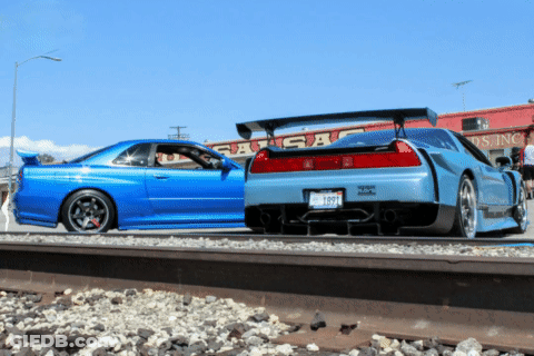 A Blue Car With A License Plate That Says ' Tc ' On It Is Parked Next To Another Car GIF