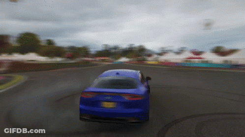 A Blue Car With A New York License Plate Is Driving On A Road GIF