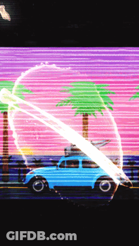 A Blue Car With A Surfboard On Top Of It Is Driving Down A Road GIF