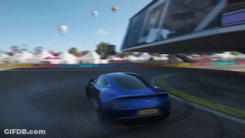 A Blue Car With A Yellow License Plate Is Driving Down A Track GIF
