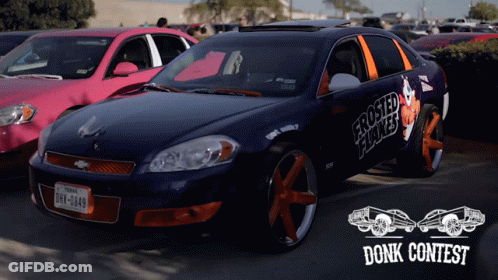 A Blue Car With Frosted Flakes On The Side Is Parked Next To A Pink Car GIF
