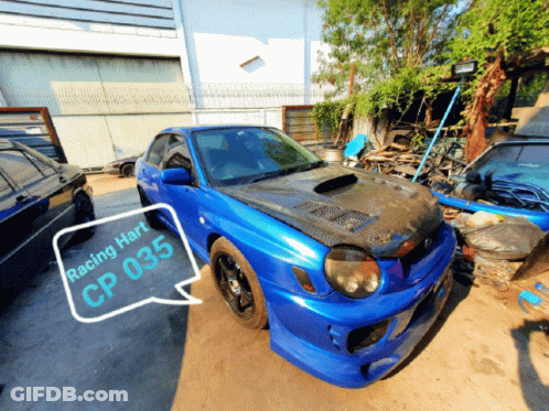 A Blue Car With Racing Hart Cp 035 On The Front GIF