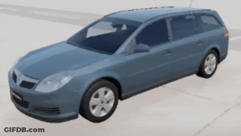 A Blue Car With Silver Wheels Is Parked On The Side Of The Road GIF