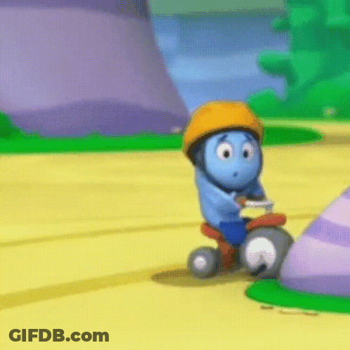 A Blue Cartoon Character Wearing An Orange Helmet Is Riding A Tricycle On A Yellow Road GIF