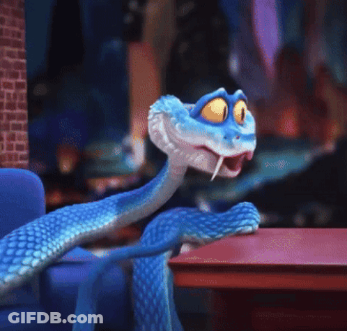 A Blue Cartoon Snake With Yellow Eyes Is Sitting On A Table GIF