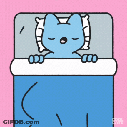 A Blue Cat Is Sleeping In A Bed With A Pillow GIF