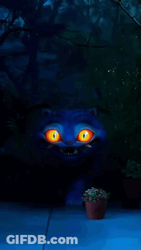 A Blue Cat With Orange Eyes And Sharp Teeth Stands In A Dark Forest GIF
