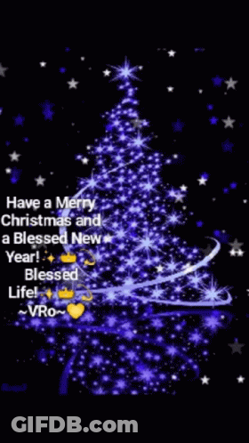 A Blue Christmas Tree With A Message That Says Have A Merry Christmas And A Blessed New Year . GIF