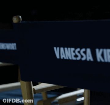 A Blue Director 'S Chair With Vanessa Kirby Written On It GIF