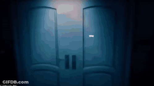 A Blue Door With A Light Shining Through It GIF