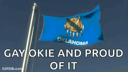 A Blue Flag With Oklahoma Written On It Is Flying In The Wind GIF