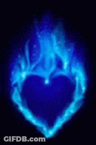 A Blue Heart Made Of Flames On A Black Background . GIF