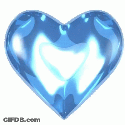 A Blue Heart On A White Background That Looks Like A Sapphire GIF