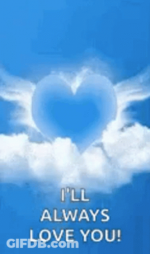 A Blue Heart With White Wings Is Floating In The Clouds . GIF