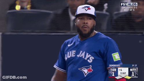 A Blue Jays Baseball Player Is Looking At Another Player GIF