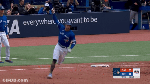 A Blue Jays Player Runs To First Base GIF