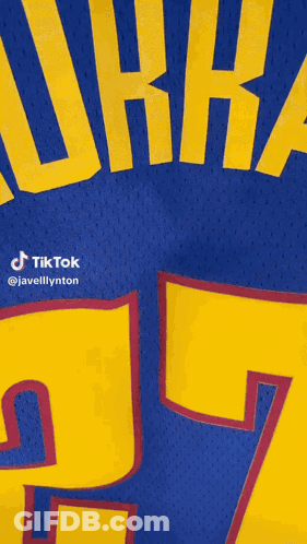 A Blue Jersey With Yellow Letters That Says Murray 27 GIF
