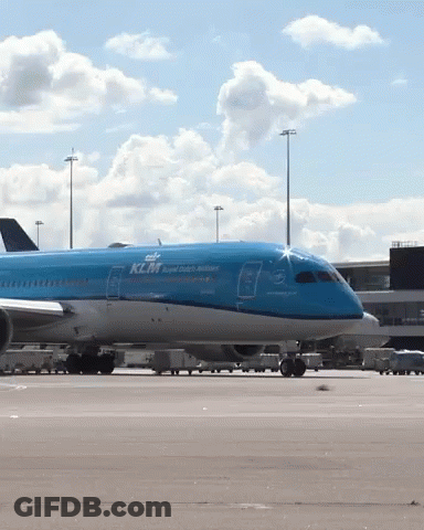 A Blue Klm Airplane Sits On The Tarmac At An Airport GIF