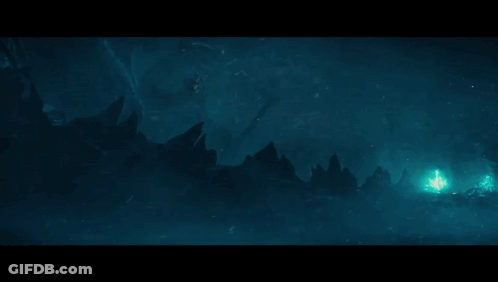 A Blue Light Is Coming Out Of A Cave In The Dark GIF