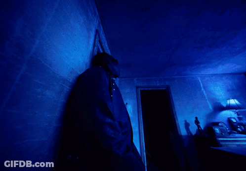 A Blue Light Is Shining On A Dark Blue Background GIF