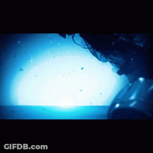 A Blue Light Is Shining On A Dark Surface GIF