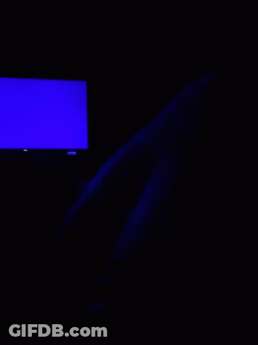A Blue Light Is Shining On A Dark Surface In The Dark . GIF