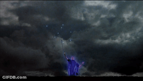 A Blue Lightning Bolt Strikes A Person In The Dark GIF